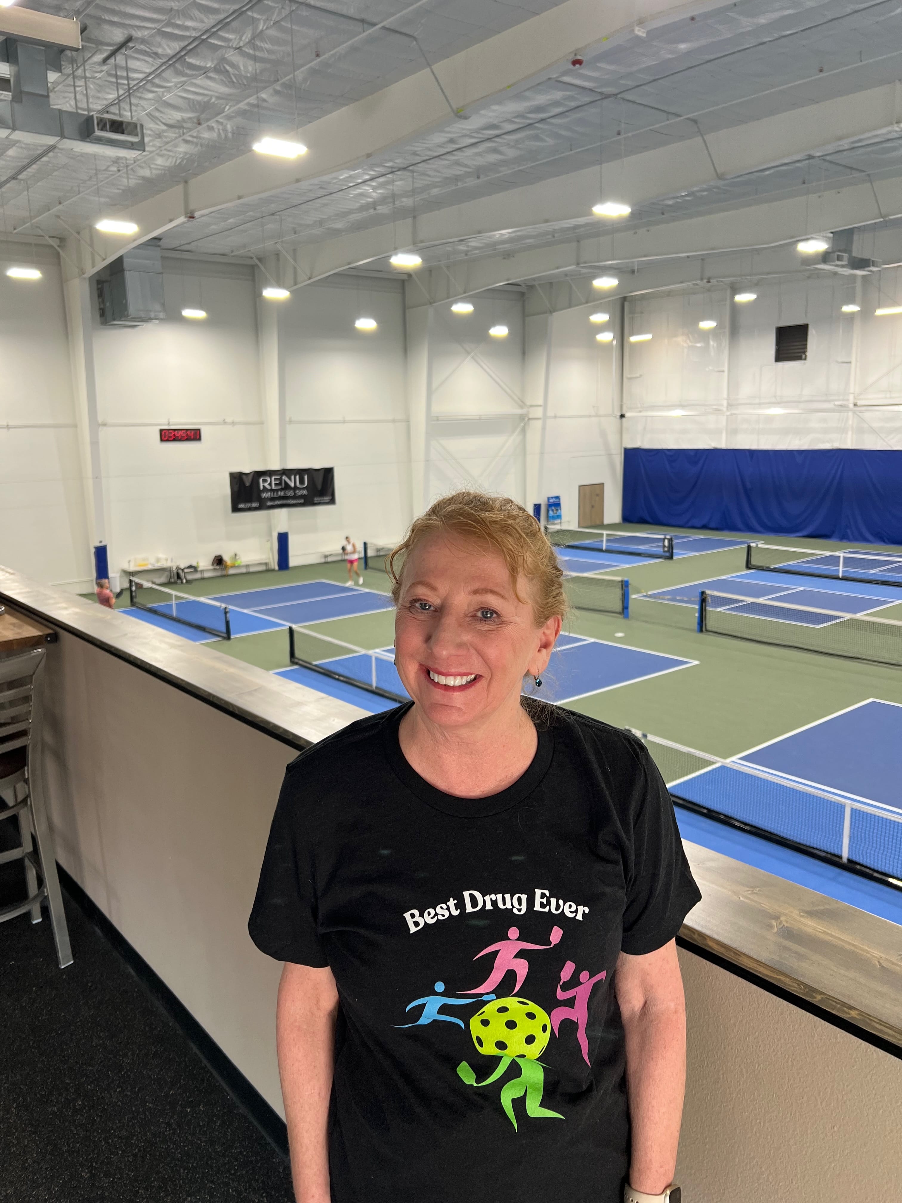 Sue posing in a Best Drug Ever Pickleball T-shirt